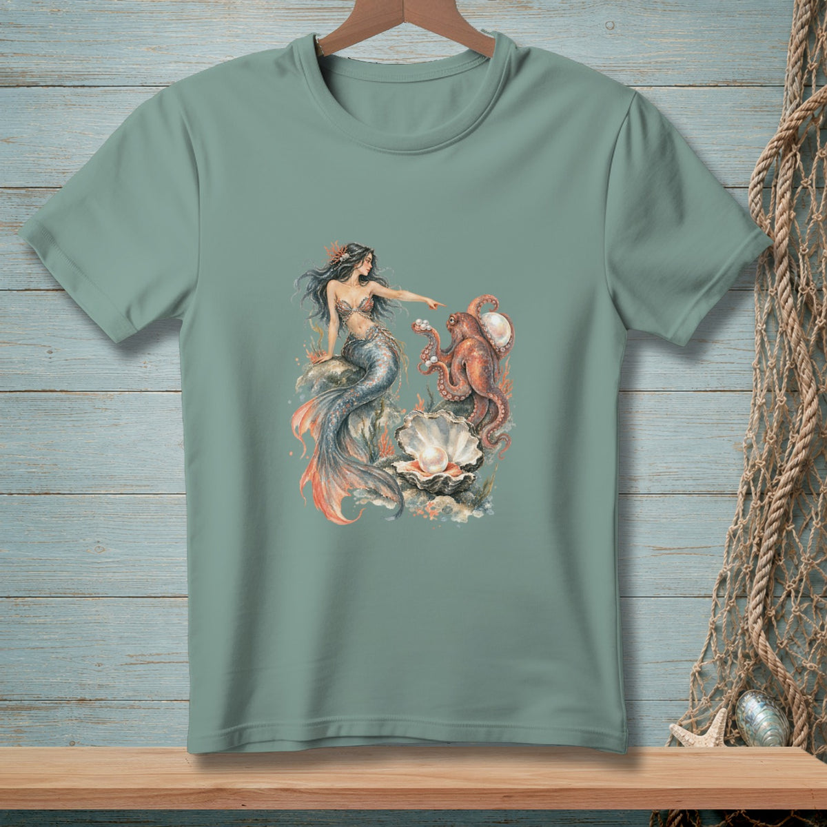 Teal t-shirt with watercolor art of a mermaid and octopus near a giant pearl.