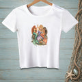 White t-shirt with graphic of three mermaids on rocks, holding champagne glasses.