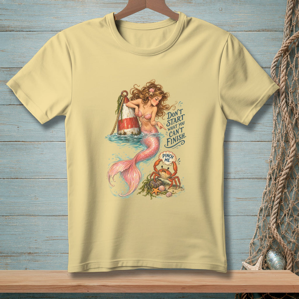 Mermaid and crab illustration on a light yellow t-shirt with text.
