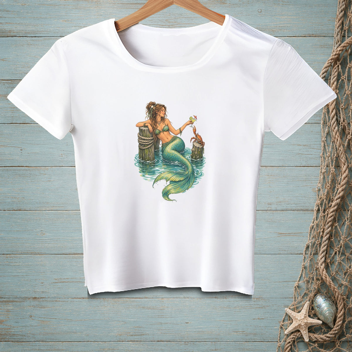 Mermaid sitting on dock post with a crab and a drink, on a white t-shirt.