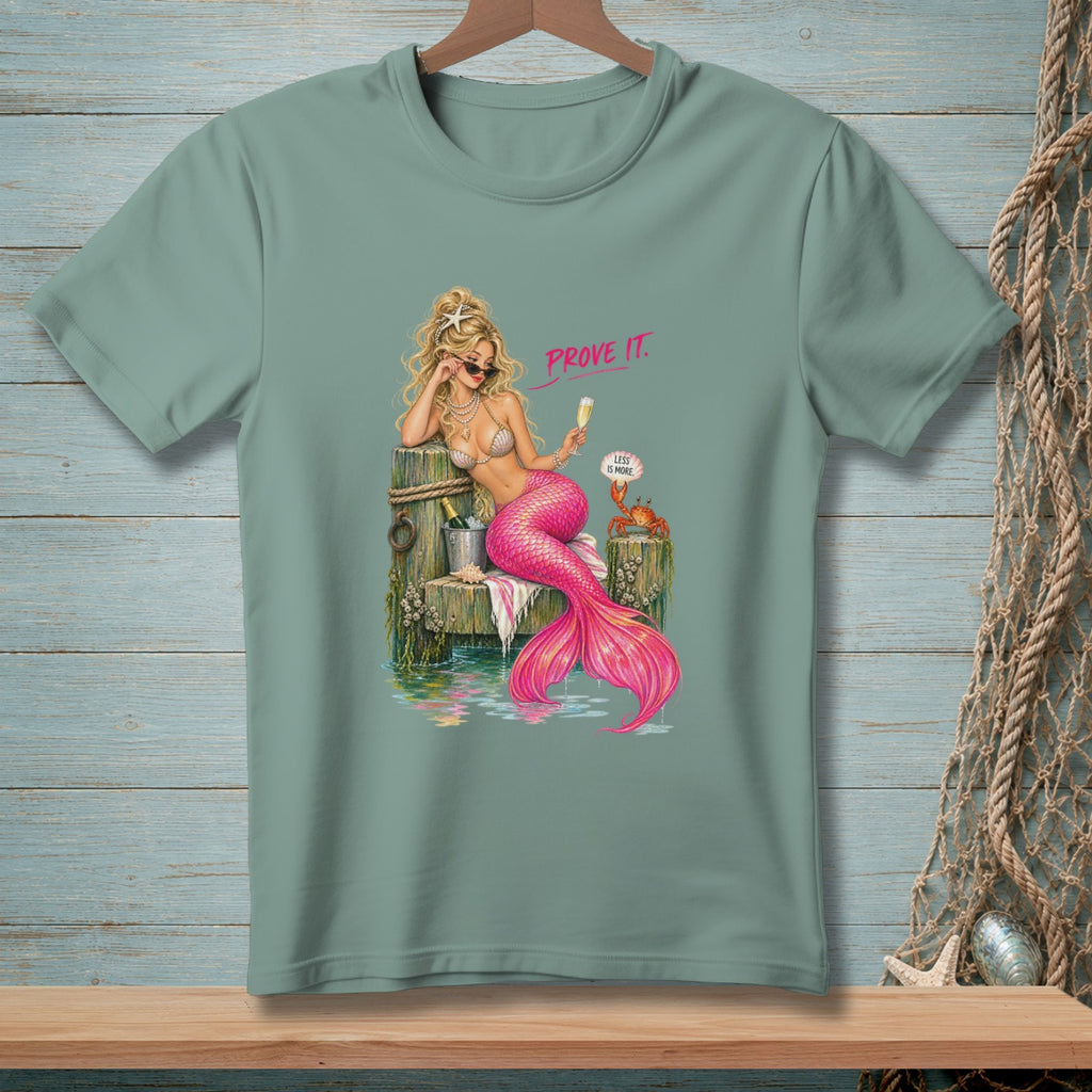 Mermaid with pink tail and sunglasses holding champagne, text "PROVE IT."