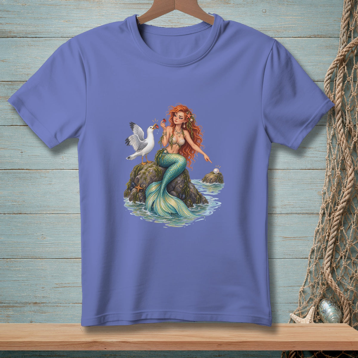 Mermaid with red hair sitting on a rock with a seagull and a pearl.