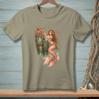 Mermaid with octopus and mirror, text "AS EXPECTED" on a tan t-shirt.