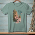 Mermaid sitting on a pier post with text "Don't Touch the Mermaid Hair".