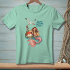 Mermaid with drink on buoy, seagull drops drink, text "ADAPT. OVERCOME. ORDER ANOTHER."
