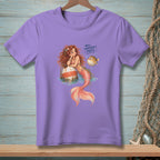 Purple t-shirt with a mermaid and pufferfish graphic that reads "Well, Somebody's Puffy!"