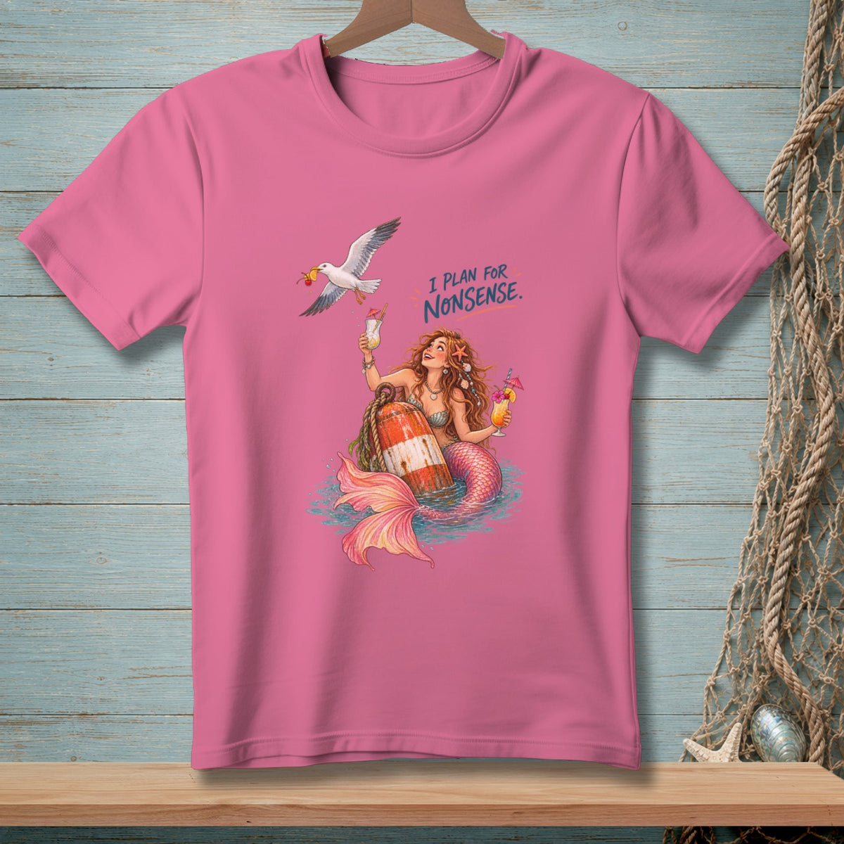 Mermaid with cocktails and seagull on pink t-shirt with text "I PLAN FOR NONSENSE."
