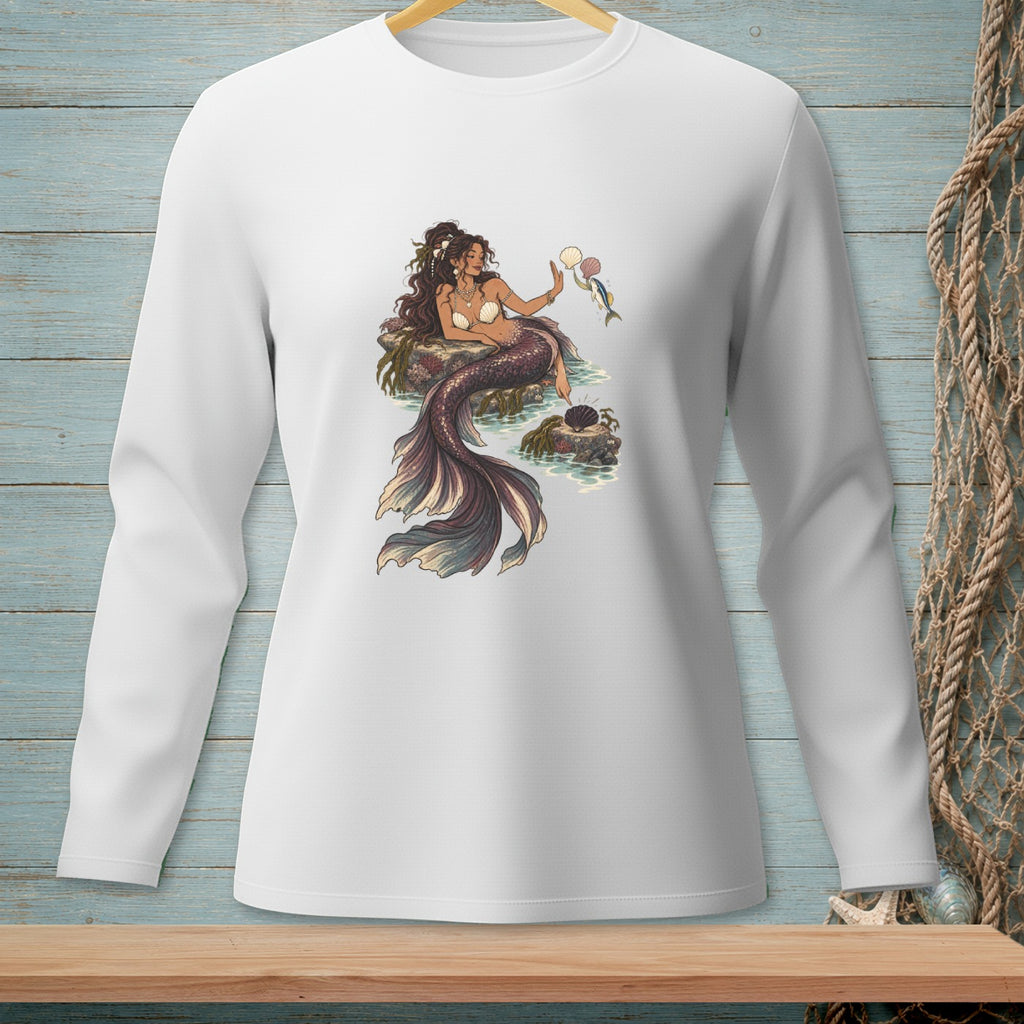 Illustration of a mermaid sitting on rocks, holding shells and a small fish.