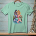 Two mermaids with colorful tails sitting on a pier looking at a smartphone.