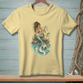 Mermaid sitting on a rock holding a map with a fish swimming nearby.