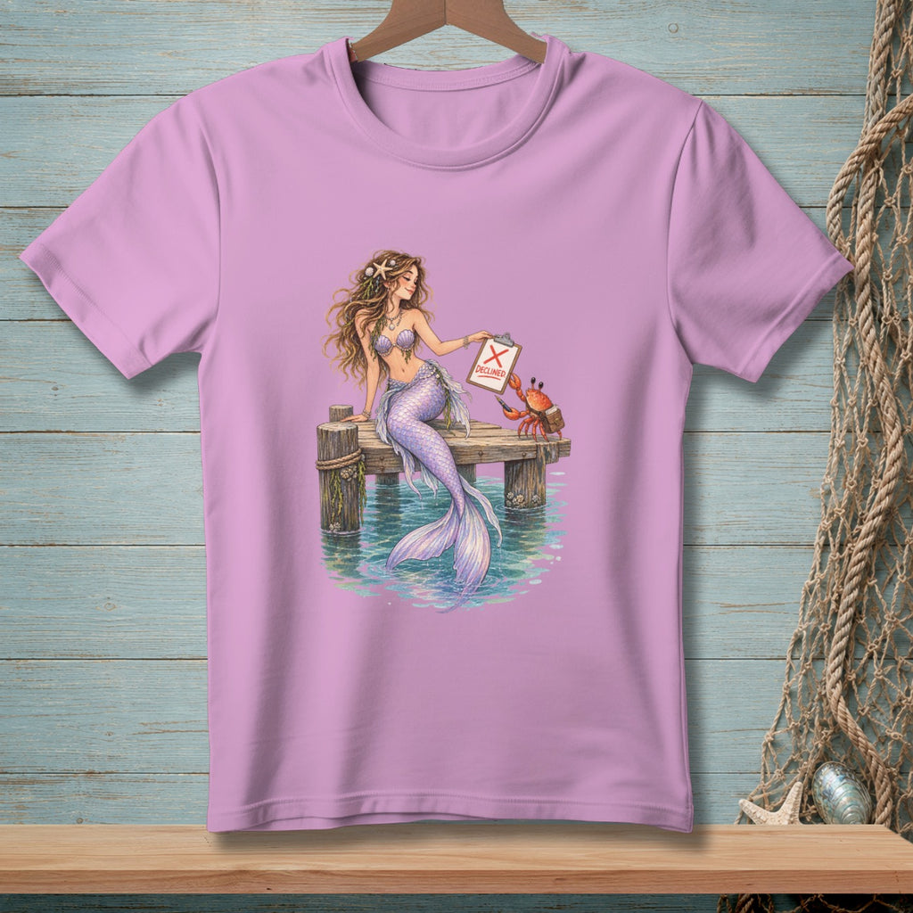 Mermaid holding clipboard with "DECLINED" and crab on a pier.