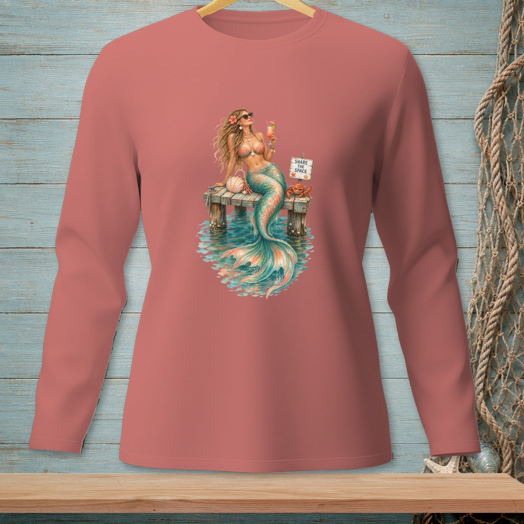 Mermaid with cocktail on a dock with sign "SHARE THE SPACE"
