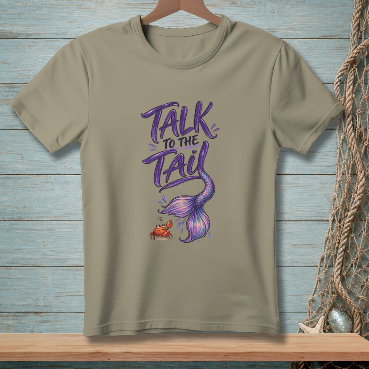 Taupe t-shirt with "Talk to the Tail" and a mermaid tail graphic.