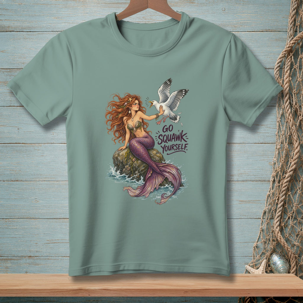 Sage green t-shirt featuring a mermaid on a rock gesturing at a seagull with the text Go Squawk Yourself.