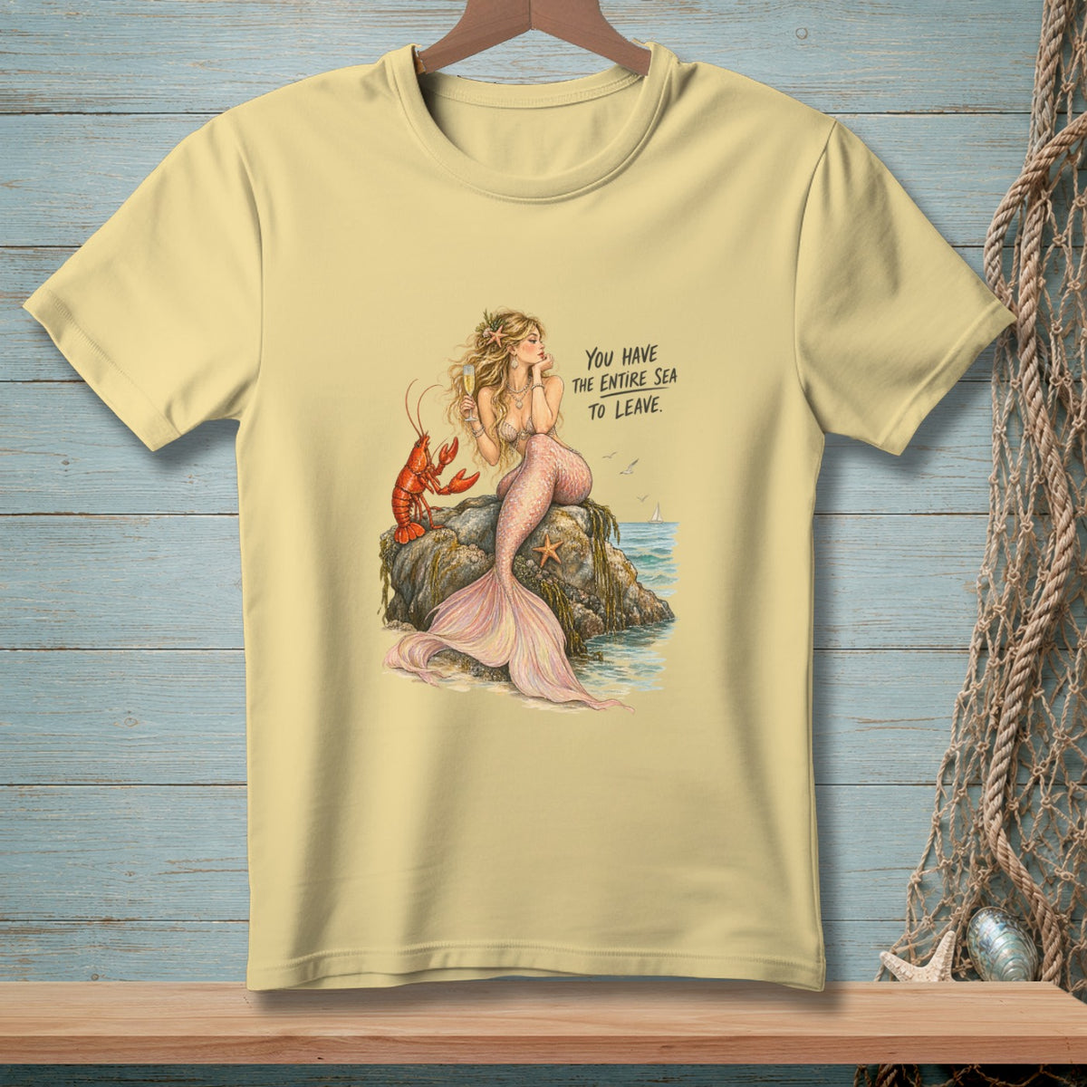 Mermaid and lobster on rock with text "YOU HAVE THE ENTIRE SEA TO LEAVE."