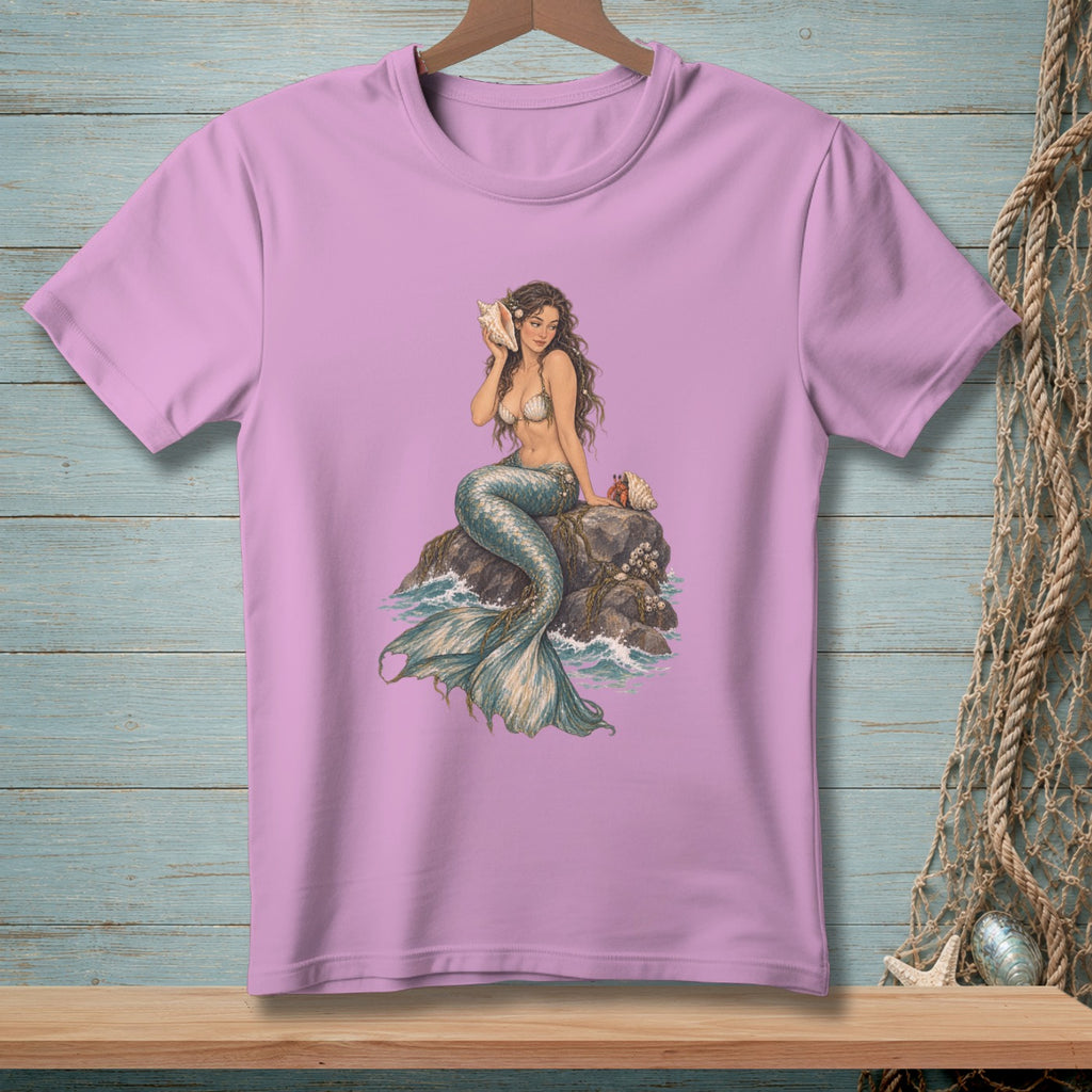Lavender t-shirt with a mermaid sitting on rocks, holding a seashell to her ear.