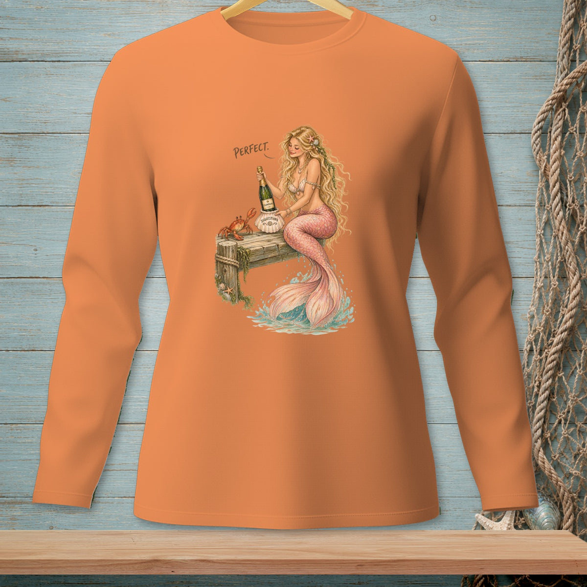 Mermaid holding champagne bottle on dock with crab, text "PERFECT."