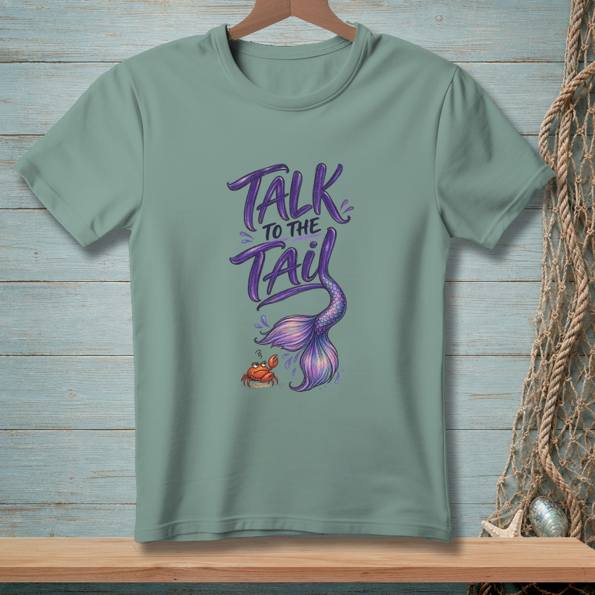 Green t-shirt with "Talk to the Tail" text, mermaid tail, and crab graphic.