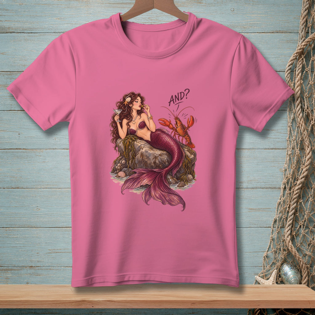 Pink t-shirt with a mermaid and lobster graphic that says "AND?".