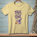 Yellow t-shirt with purple text "TALK TO THE TAIL" and a mermaid tail and crab.