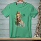 Green t-shirt with a mermaid and crab graphic and text "Or Raise Your Game."