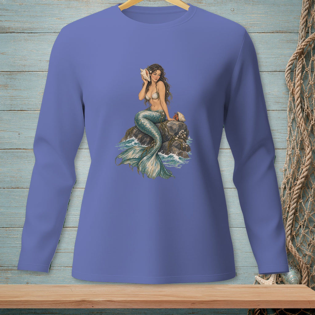 Long-sleeve shirt with a mermaid holding a seashell on a rock surrounded by water.