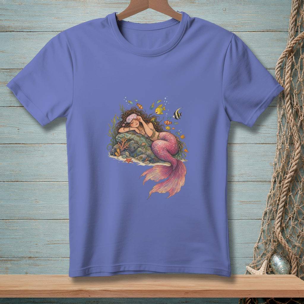 Illustration of a sleeping mermaid with pink tail surrounded by coral and fish.