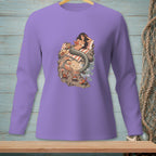 Mermaid reading on a beach with crabs, on a purple long-sleeve shirt.