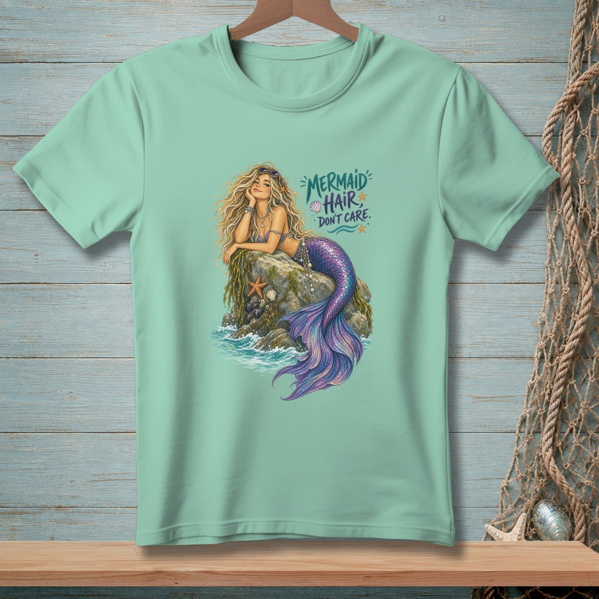 Mint green t-shirt with a mermaid graphic and "Mermaid Hair Don't Care" text.