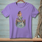Purple t-shirt with illustration of a mermaid on a dock.