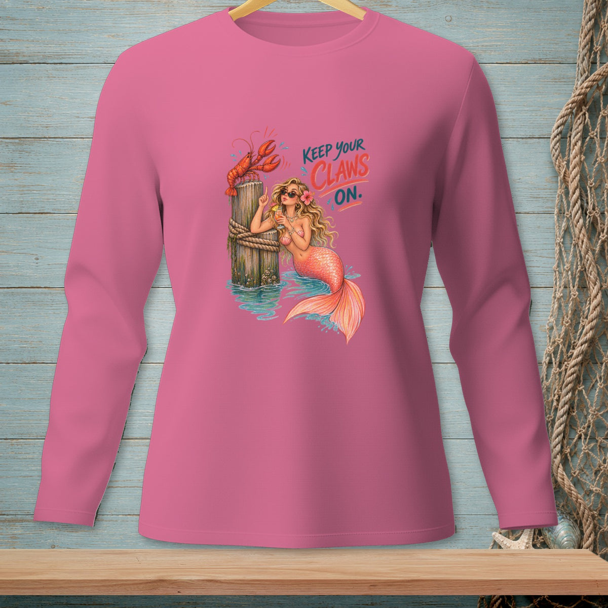 Pink long-sleeve shirt with mermaid, lobster, and "Keep Your Claws On" text.