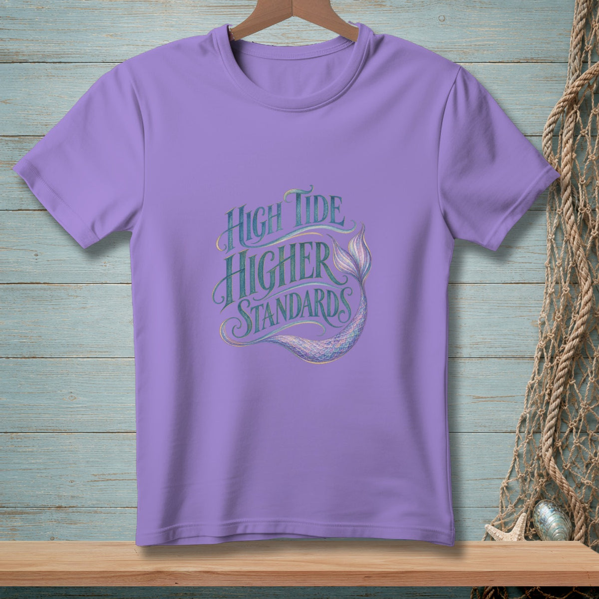 Lavender t-shirt with "High Tide Higher Standards" text and mermaid tail graphic.