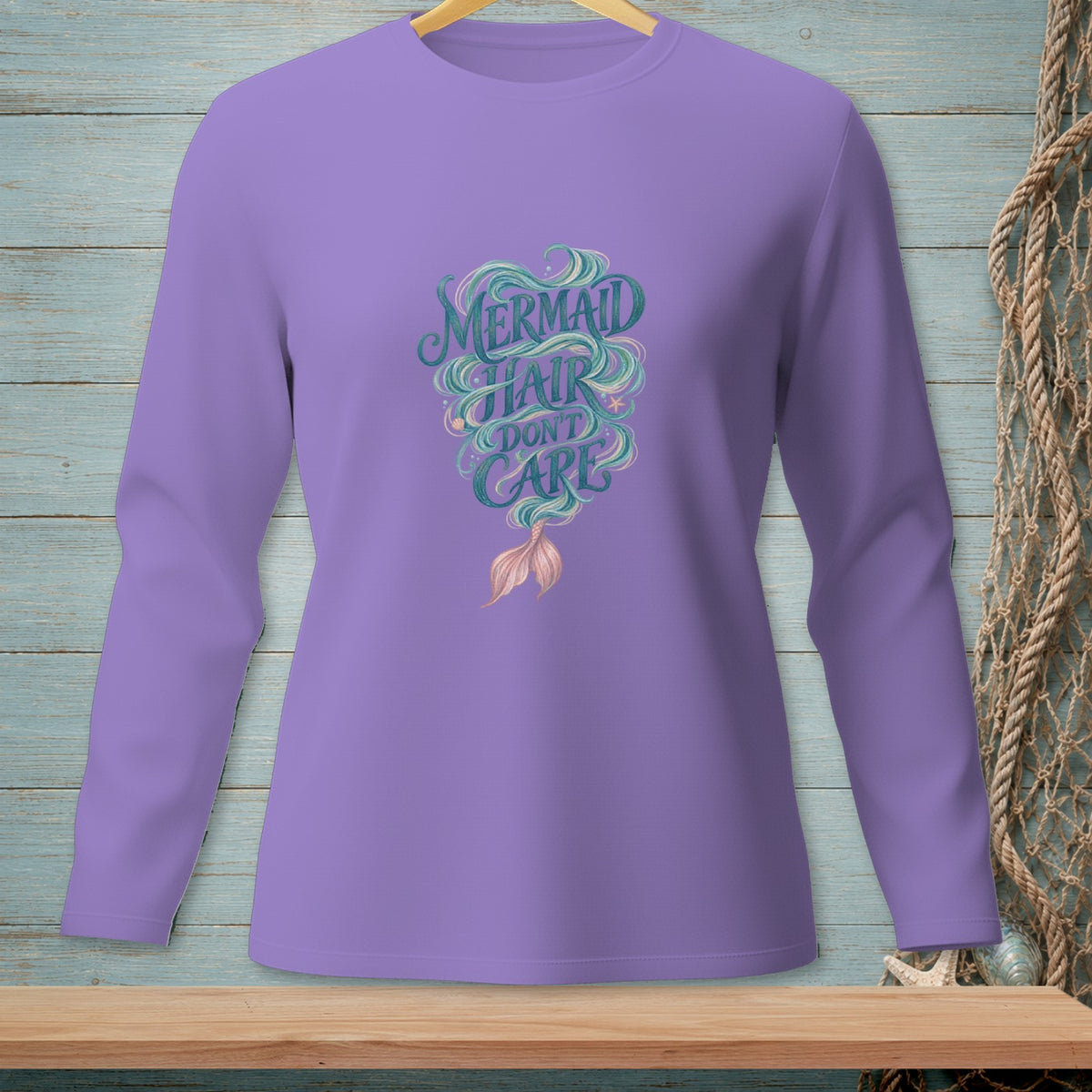 Purple long sleeve shirt with "Mermaid Hair Don't Care" graphic and mermaid tail.