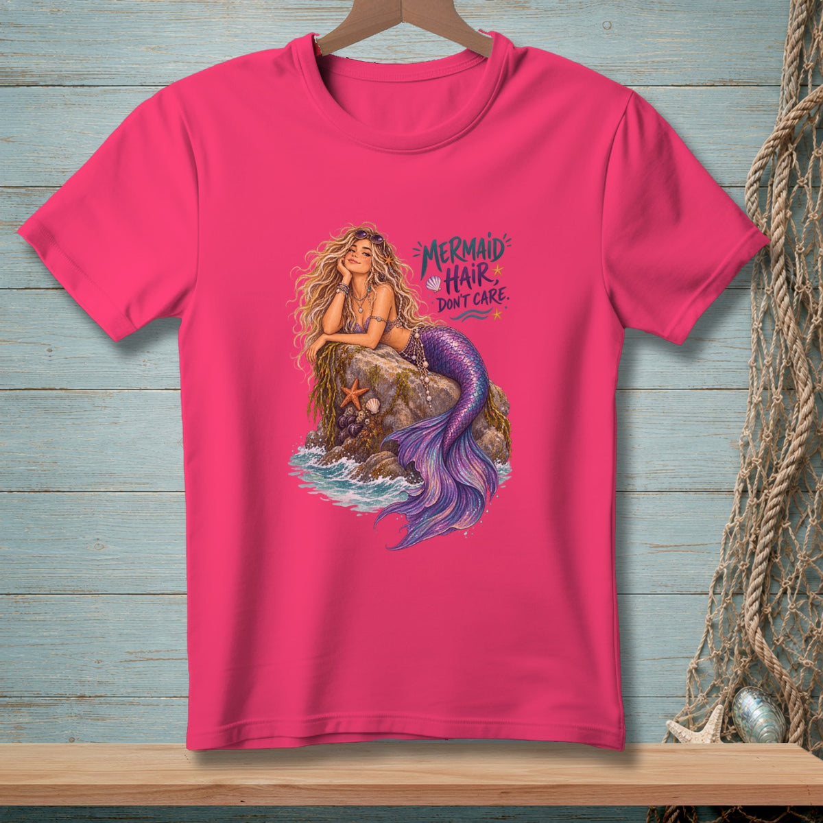 Pink t-shirt with a mermaid illustration and the text "Mermaid Hair Don't Care."