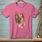 Pink t-shirt with mermaid, octopus, and mirror graphic with "AS EXPECTED" text.