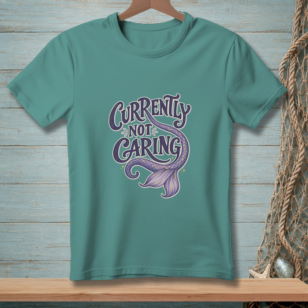 Teal t-shirt with "Currently Not Caring" text and a purple mermaid tail.