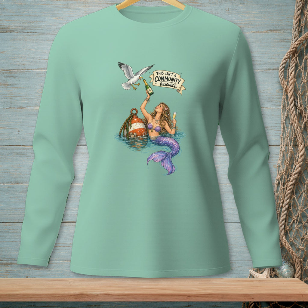 Mermaid with champagne and a seagull under banner "THIS ISN'T A COMMUNITY RESOURCE."