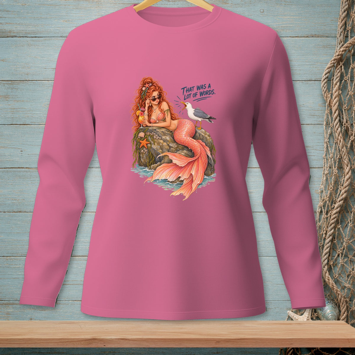 Pink long-sleeve shirt with mermaid and seagull graphic that says "That was a lot of words."