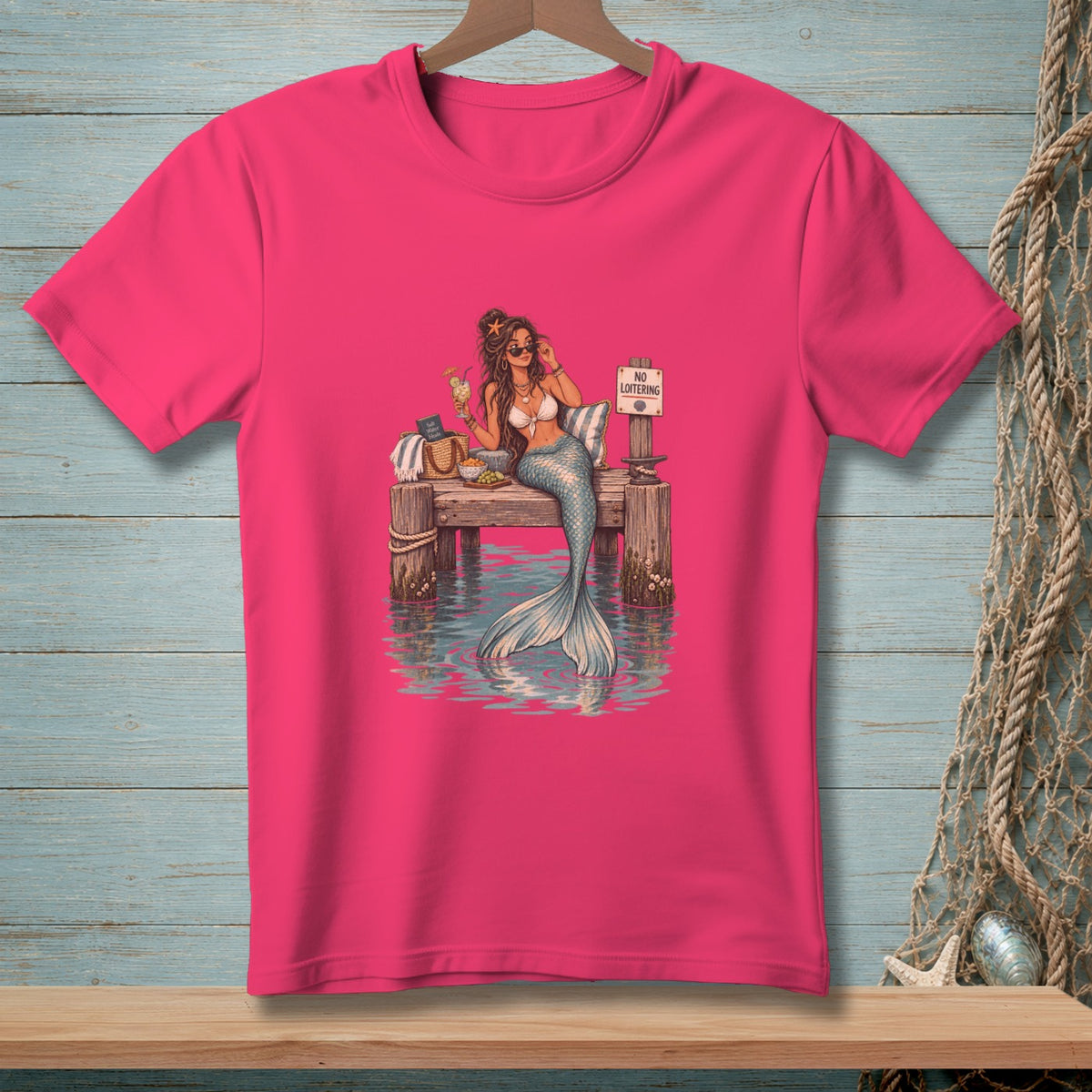 Mermaid with a drink on a dock with a "No Loitering" sign.