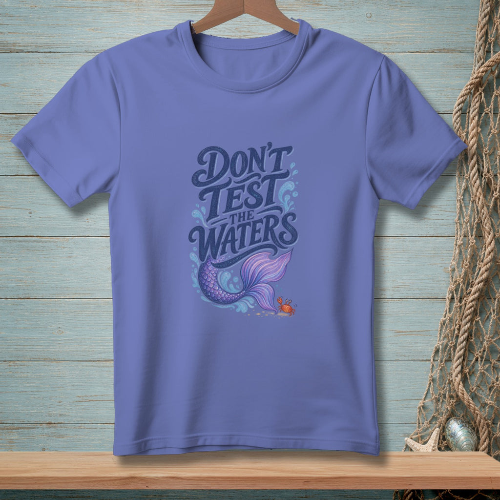 Periwinkle t-shirt with "DON'T TEST THE WATERS" text and mermaid tail graphic.