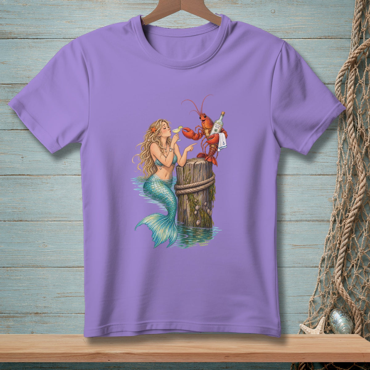 Purple t-shirt with a mermaid and lobster on a wooden post, serving drinks.