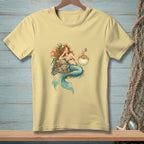 Yellow t-shirt with a drawing of a mermaid and a pufferfish.