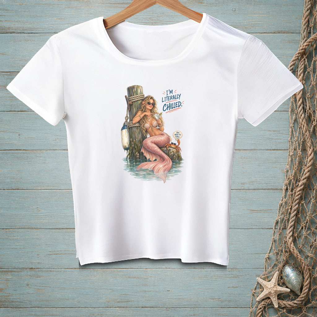 White t-shirt with a mermaid design and text "I'M LITERALLY CHILLED".