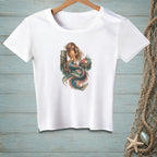 White t-shirt with a colorful mermaid graphic sitting on a wooden post.