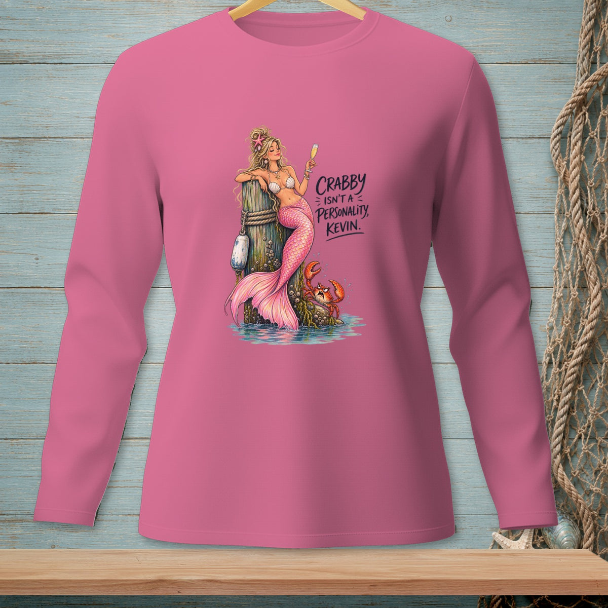 Pink long-sleeve shirt with a mermaid and crab graphic that reads "Crabby isn't a personality, Kevin."
