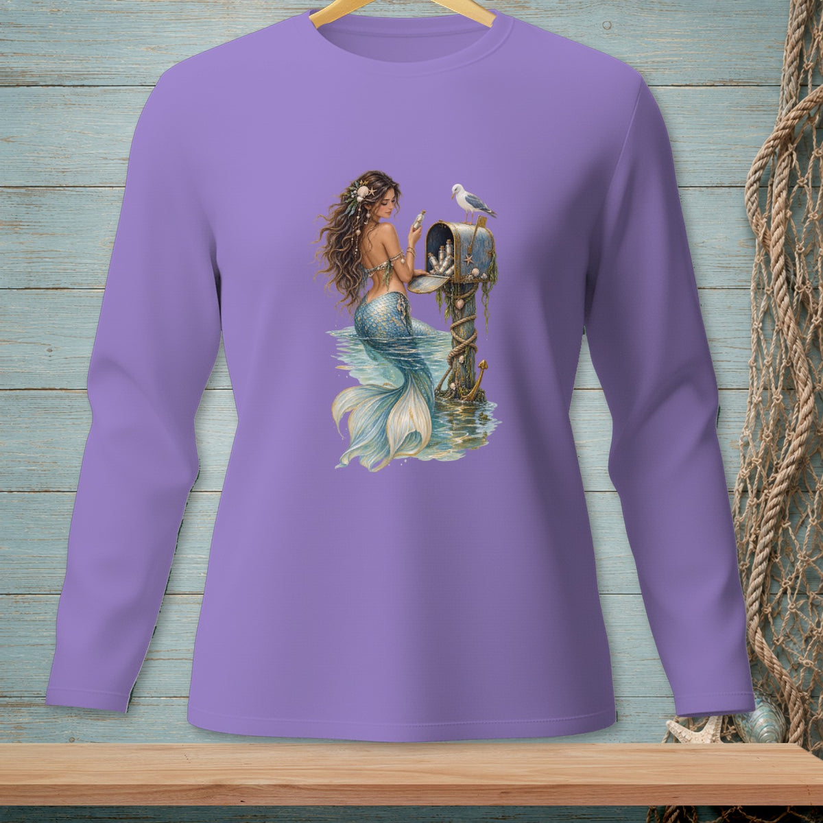 Mermaid at a mailbox with a seagull, long-sleeve lavender t-shirt graphic.