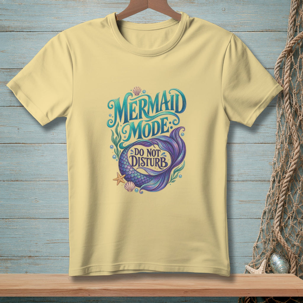 Yellow t-shirt with "Mermaid Mode: Do Not Disturb" text and mermaid tail graphic.