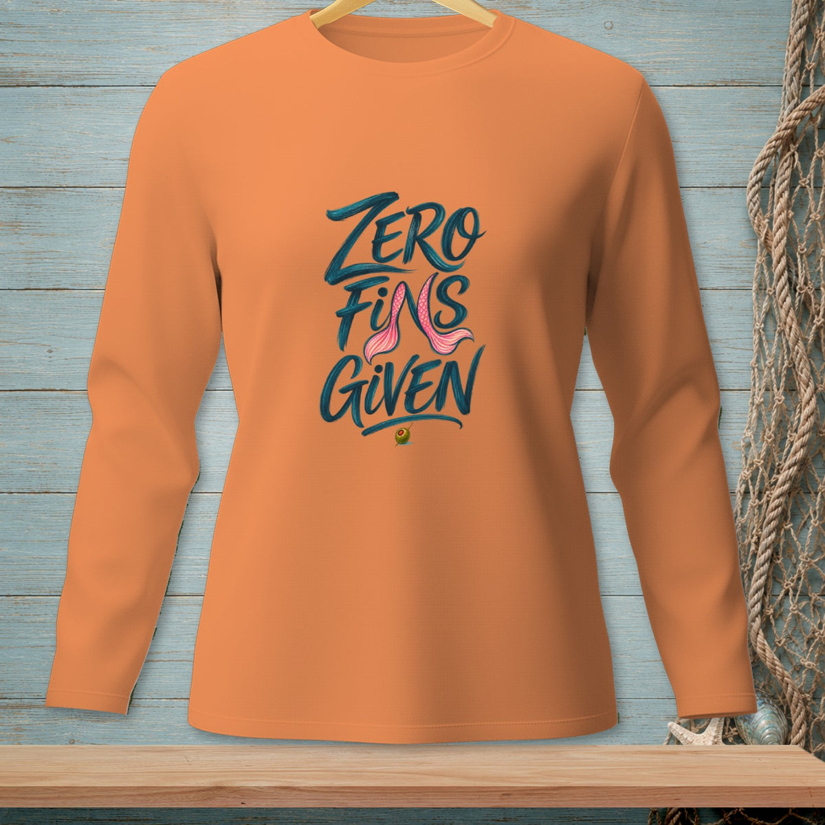 Orange long-sleeve shirt with "Zero Fins Given" graphic and mermaid tail.