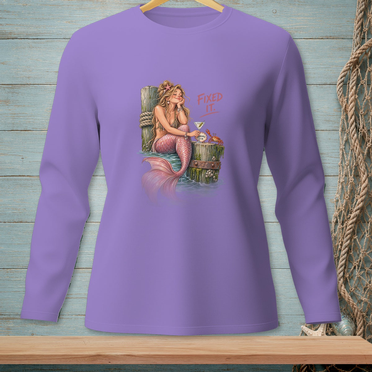 Purple long-sleeve shirt with a mermaid graphic and text "Fixed It."