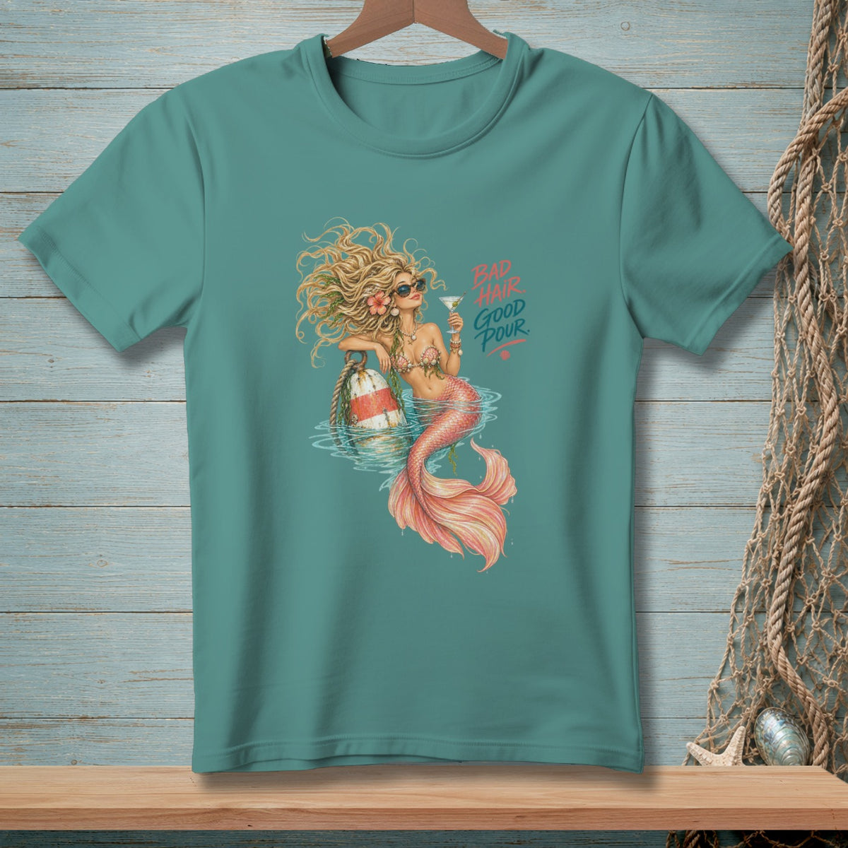 Mermaid with cocktail and life preserver, text says "Bad Hair Good Pour".